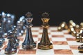 Strategy of leadership as king facing each other in wooden chess board in checkmate position. Business marketing of competition Royalty Free Stock Photo