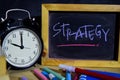 Strategy on phrase colorful handwritten on blackboard. Education and business concept. Royalty Free Stock Photo