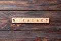 STRATEGY word written on wood block. STRATEGY text on cement table for your desing, concept Royalty Free Stock Photo