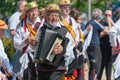 Close up of traditional morris dancer with an accordion