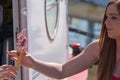 Woman picks up raspberry ice cream Royalty Free Stock Photo