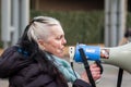 STRATFORD, LONDON, ENGLAND- 5 December 2020: Anti-lockdown Standupx protester making a speech at a protest in Stratford