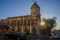 Strathcona Public Building - an old brick house with a tower and clock. Old post office. Amazing sunset, sun rays, clear sky.