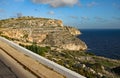 A stratified cliff by the roadside in Malta Royalty Free Stock Photo