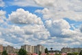 Stratocumulus clouds form a layer and move fast from left to right over city buildings, in a residential neighborhood of Bucharest Royalty Free Stock Photo