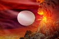 stratovolcano eruption at night with explosion on Lao People Democratic Republic flag background, problems of eruption and