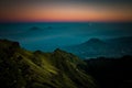 Stratovolcano and mountains in morning fog Royalty Free Stock Photo