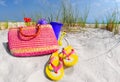 Straw bag and accessories on sand dune Royalty Free Stock Photo