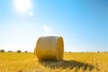 Straw Bales on the Bright Yellow Field under Blue Sky. Royalty Free Stock Photo