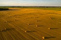 Straw bales on farmland with a blue cloudy sky.Harvested field with bales in Europe.Harvest.Belarus Royalty Free Stock Photo