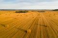 Straw bales on farmland with a blue cloudy sky.Harvested field with bales in Europe.Harvest.Belarus Royalty Free Stock Photo