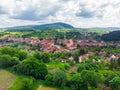 Straw bales on the field near Saschiz fortified church in Saschiz villages, Sibiu, Transylvania, Romania. Agriculture landscape, g Royalty Free Stock Photo