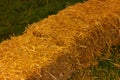 straw in bales. haystack on green grass. farmers market decorate and harvest festival Royalty Free Stock Photo