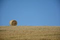 A straw bales in the horizon on harvested field Royalty Free Stock Photo