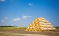 Straw bales stacked in a field at summer time, South Moravia region