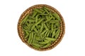 Straw basket with green peas