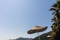 Straw beach umbrella against the sky Royalty Free Stock Photo