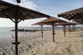 Straw beach umbrellas. On the beach. Ukraine