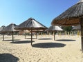 Straw beach umbrellas Royalty Free Stock Photo