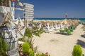 Straw beach umbrellas and sun chairs on a sandy beach on the east coast of Zakynthos island, Greece Royalty Free Stock Photo