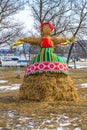 Straw doll on the street is decorated to traditional slavic national holiday Maslenitsa
