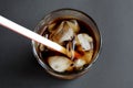 In a glass cup is ice with cola Royalty Free Stock Photo