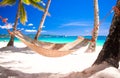 Straw hammock on tropical white sandy beach Royalty Free Stock Photo