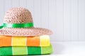 Straw hat with beach towels Royalty Free Stock Photo