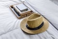 Straw hat on bed Royalty Free Stock Photo