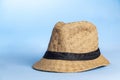 Straw hat on blue background