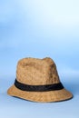 Straw hat on blue background