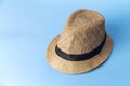 Straw hat on blue background