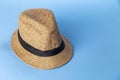 Straw hat on blue background