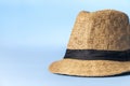 Straw hat on blue background