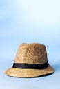 Straw hat on blue background