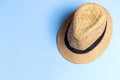 Straw hat on blue background