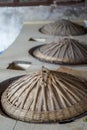 Straw hat earthen stove in rural Chinese kitchen