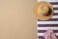 Straw hat, flip flops and space for text on beach sand, top view. Summer vacation Royalty Free Stock Photo