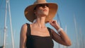 Straw hat girl relaxing on sunny nature close up. Portrait elegant woman posing Royalty Free Stock Photo