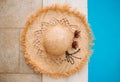 Amazing straw hat and goggles by the pool. Top view