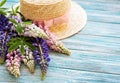 Straw hat and lupine flowers Royalty Free Stock Photo