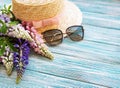 Straw hat and lupine flowers Royalty Free Stock Photo