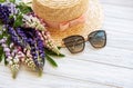 Straw hat and lupine flowers Royalty Free Stock Photo