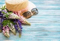 Straw hat and lupine flowers Royalty Free Stock Photo