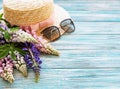 Straw hat and lupine flowers Royalty Free Stock Photo