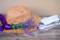 straw hat, old photographs, home archive, letter, bouquet of purple wildflowers on old wooden table, nostalgia, past love, bunch Royalty Free Stock Photo