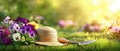 The straw hat resting beside vibrant pansies and gardening tools on fresh grass. AI generated image Royalty Free Stock Photo