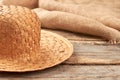 Straw hat on rustic wooden background. Royalty Free Stock Photo