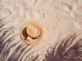 Straw hat on sand, sun protection concept. Royalty Free Stock Photo