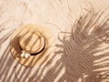 Straw hat on sand, sun protection concept Royalty Free Stock Photo